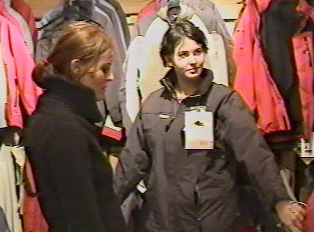 Two people shopping for jackets