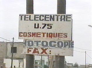 A sign alongside the road that reads "telecentre"