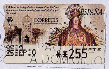 A Spanish stamp with an image of a feminine deity praying