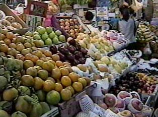 An array of fruit for sale at an outdoor market